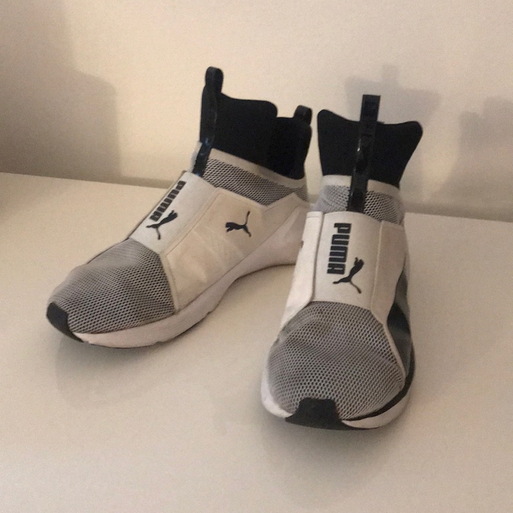 White and black Puma high top slip on sneakers